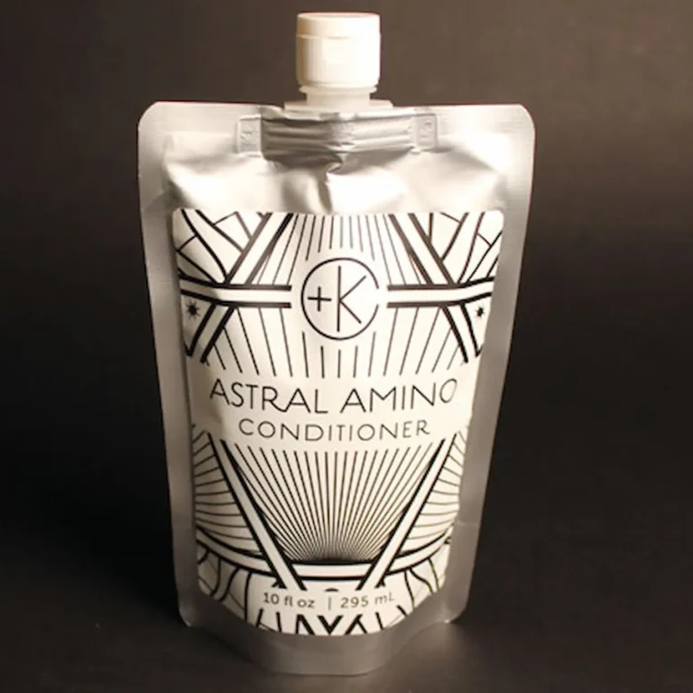 a silver packet of refillable plastic free conditioner holds a clean non toxic eco friendly amino acid conditioner.