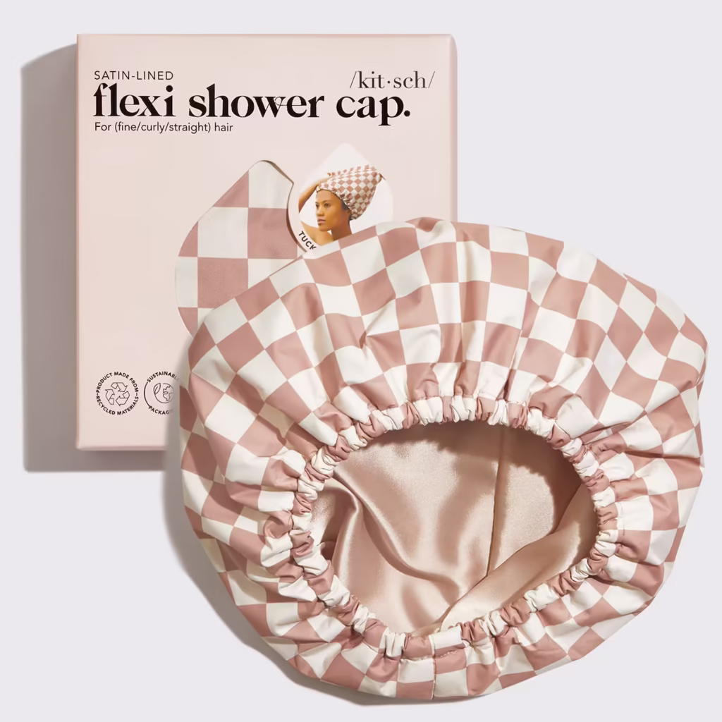 a satin lined terracotta and white checkered shower cap with it's packaged version behind it on a white background.