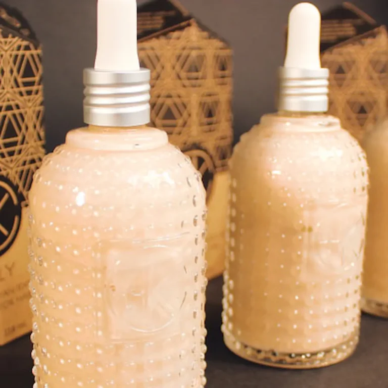 Cult+King Jelly — Himalayan texture infusion for hair in peach-pink liquid, packaged in signature textured glass bottles with dropper tops.