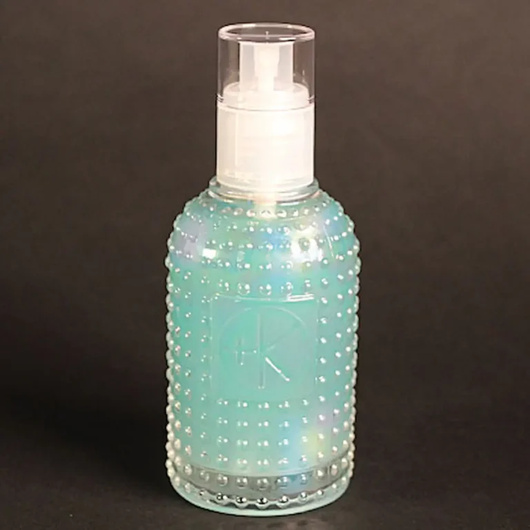 Cult+King Set Spray mini bottle — strengthening tri-phase hairspray with blue liquid in textured glass packaging.