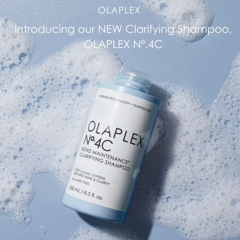 Bottle of Olaplex No. 4C Clarifying Shampoo in foamy, light blue water, a must-have for healthy hair from Erin Reye Hair.