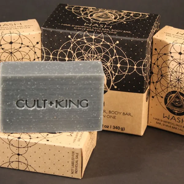 Cult+King Wash bar soap with embossed logo, displayed with geometric patterned packaging.