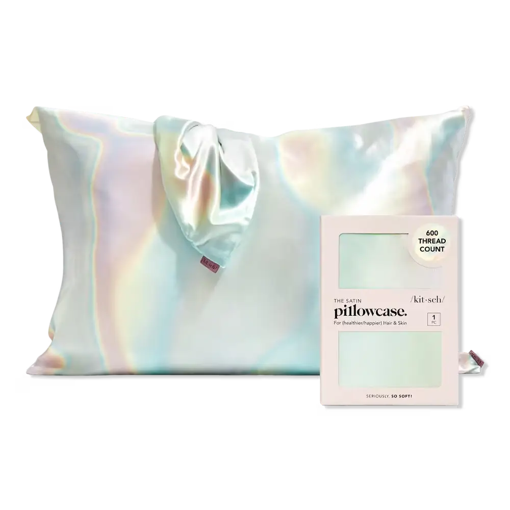 a pillowcase displayed next to it's packaged sibling with a pastel rainbow oil slick pattern