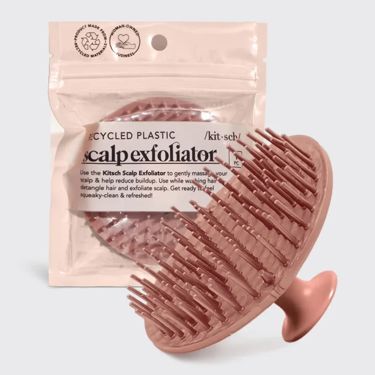 the terracotta exfoliating scalp brush both inside it's packaging and out on display.