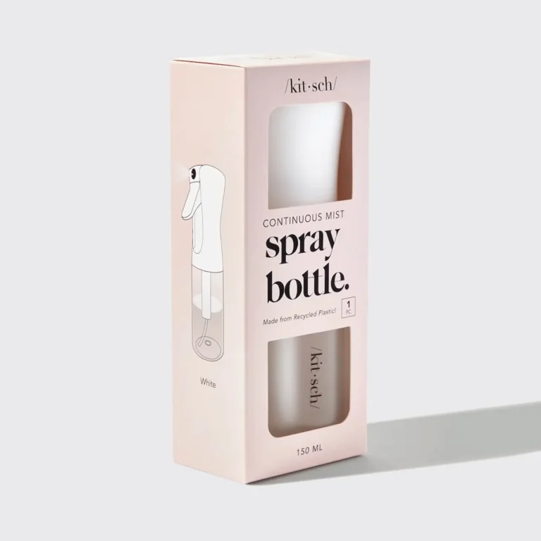 a white spray bottle on a white backgound; it has a peachy package.