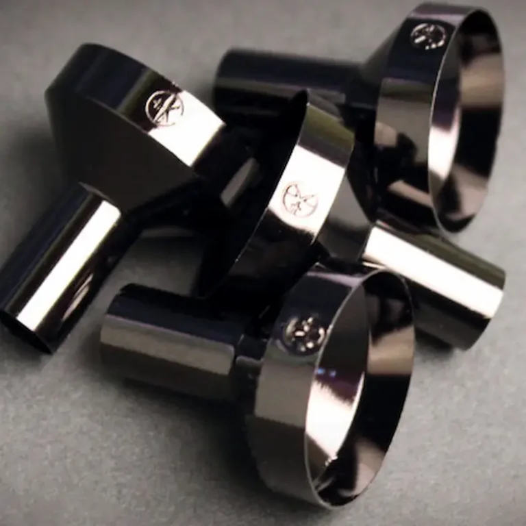 a pile of black funnels from cult + king for refilling tonik and superwater bottles