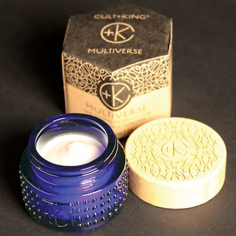 a colbalt blue pot with a bamboo lid next to it's cardboard packaging from cult + king showing multiverse product mini