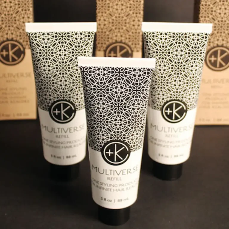 bottles of ultiverse refill containers displayed outside their boxes. they have great gatsby style design on the infinitely recyclable packaging.