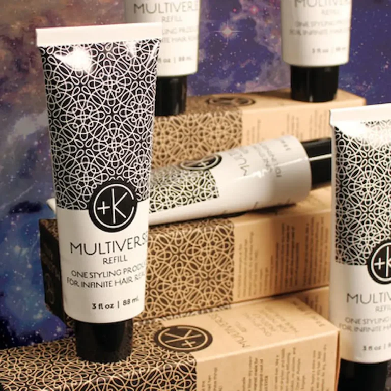 bottles of ultiverse refill containers displayed outside their boxes. they have great gatsby style design on the infinitely recyclable packaging.