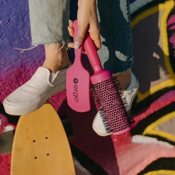 Pink Ergo paddle brush and round brush lifestyle product photo