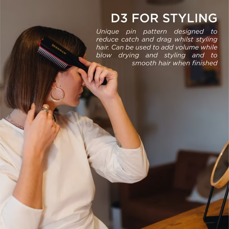 A person using a classic Denman D3 styling brush to blow-dry and smooth a short, straight bob haircut. Text overlay highlights its use for volume and smooth finishes.