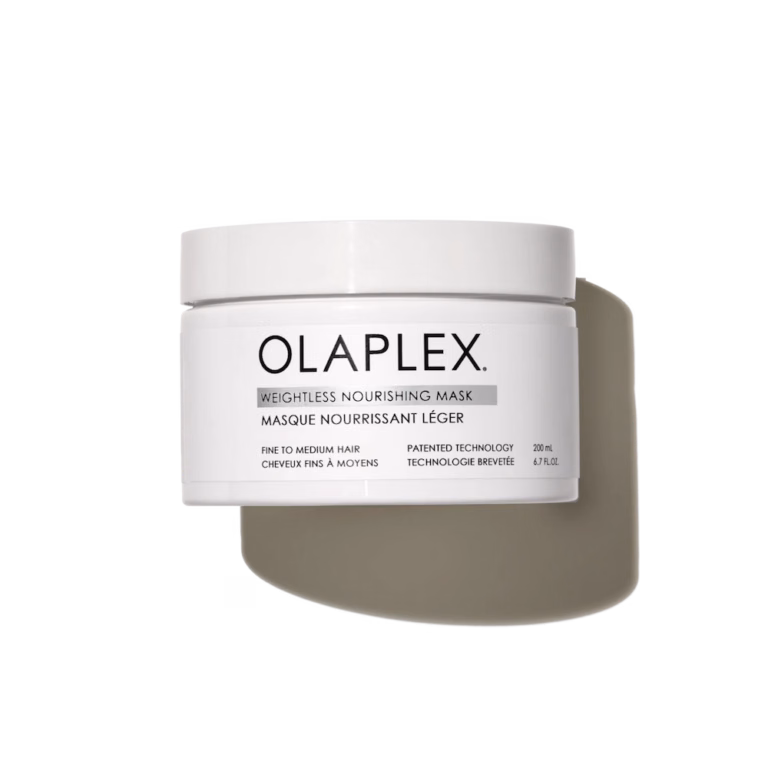 a white tub of olaplex weightless nourishing mask with a shadow behind it